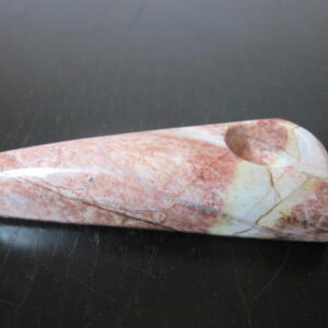 mid size red color stone pipe for marijuana use