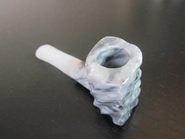 gray and white onyx stone smoking pipe
